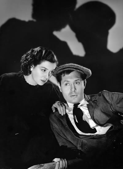Robert Montgomery and Rosalind Russell (Night Must Fall, 1937)