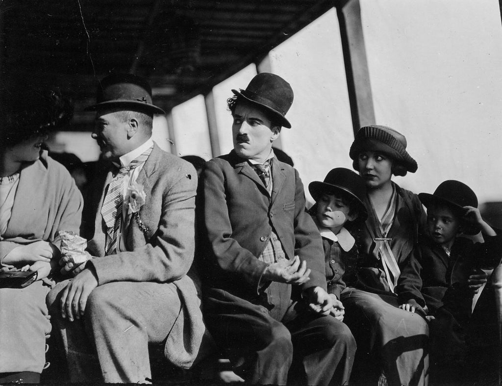 Charles Chaplin, Jackie Coogan, Marion Feducha, Babe London, Edna Purviance and Tom Wilson in A Day’s Pleasure (1919) | www.vintoz.com