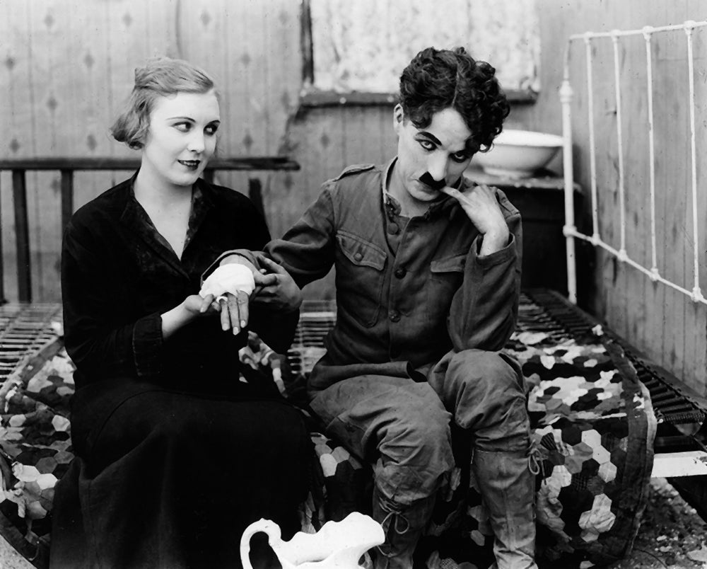 Charles Chaplin and Edna Purviance in Shoulder Arms (1918) | www.vintoz.com