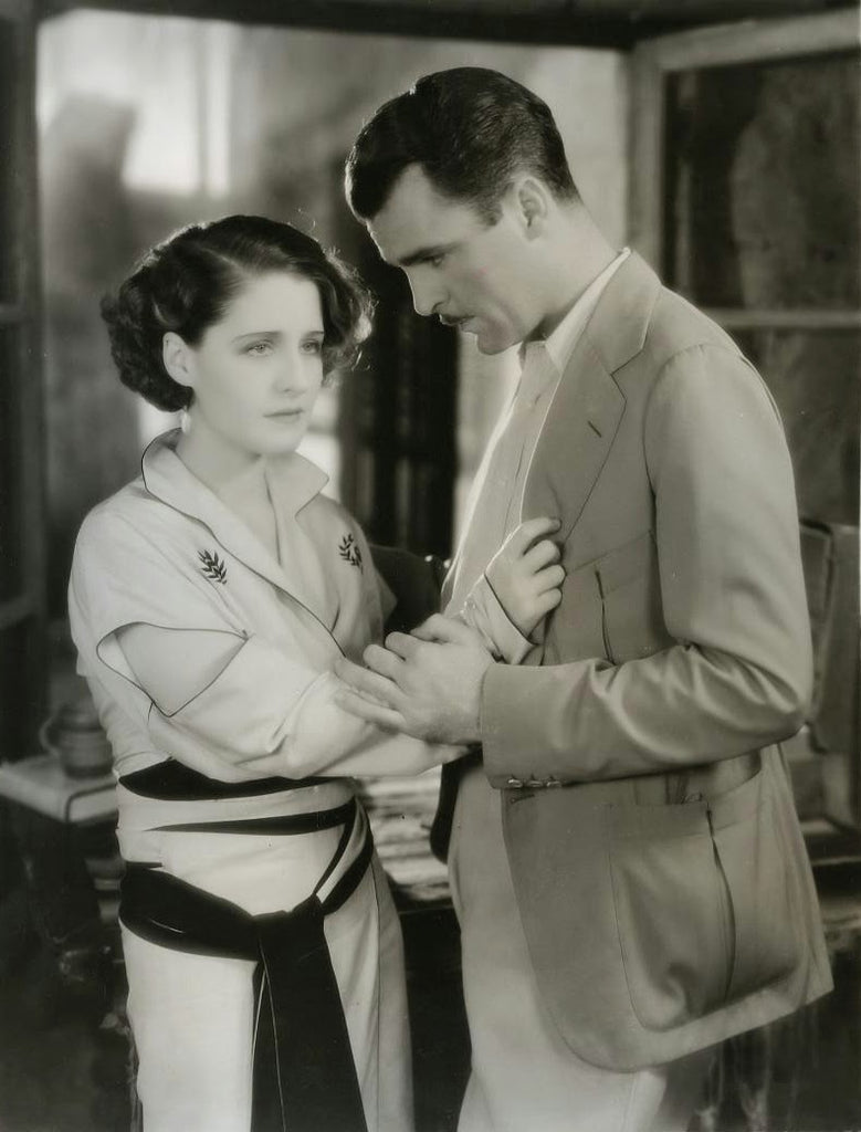 Neil Hamilton and Norma Shearer in Strangers May Kiss (1931) | www.vintoz.com